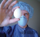 man inspecting egg.jpg