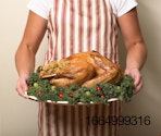 roasted-turkey-on-tray-being-held.jpg