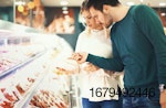 couple-looking-at-meat-in-supermarket.jpg