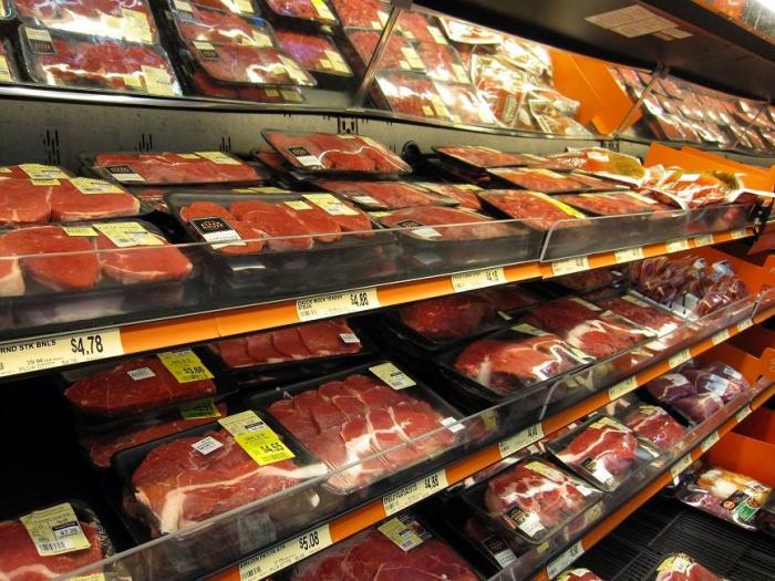 Meat on display in a grocery store.