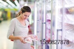 young-woman-looking-at-meat-in-store