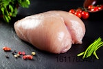 raw whole breast on slate