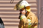 Firefighter-putting-mask-on