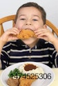 Kid eating chicken